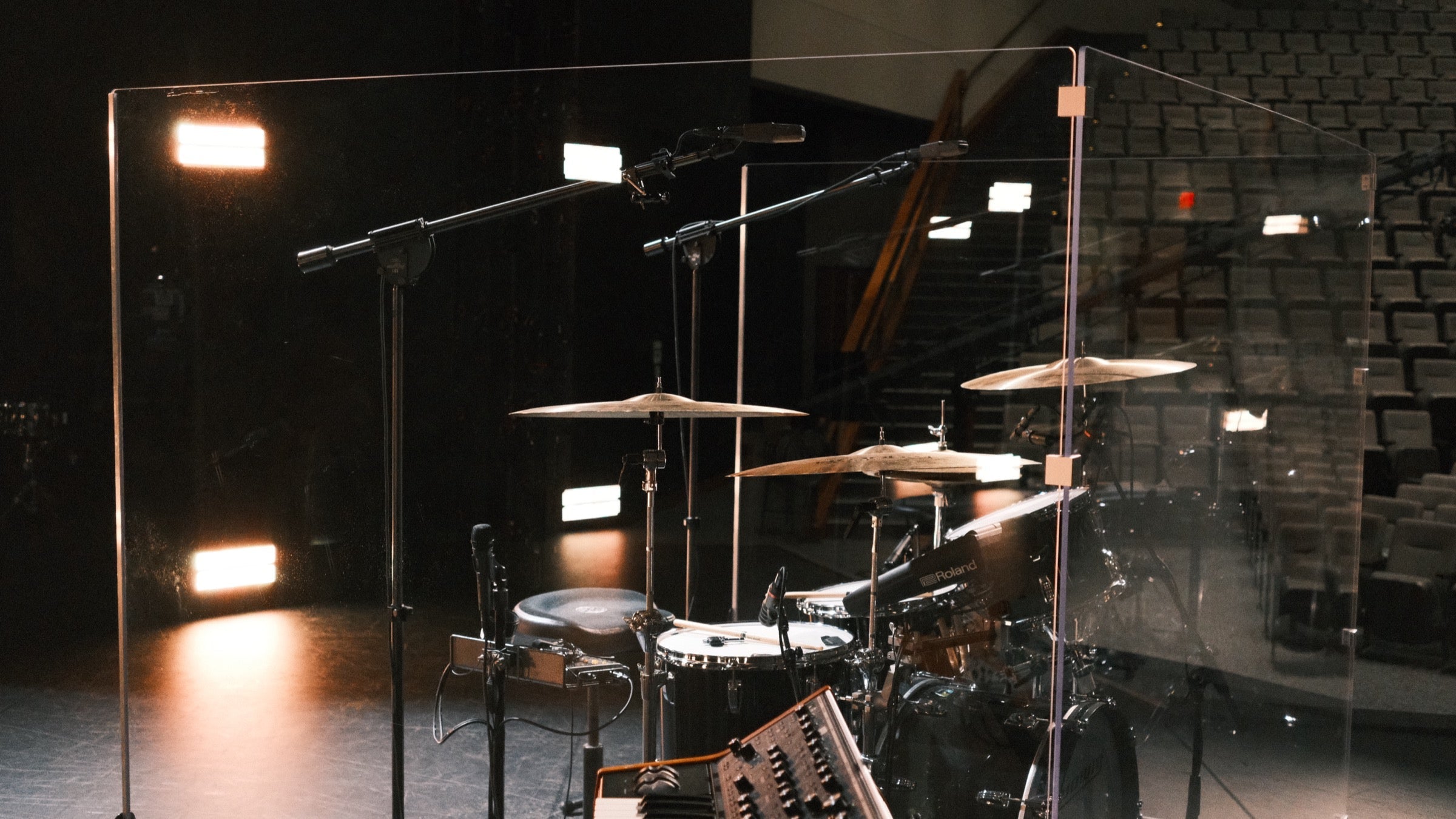 Pure Shields drum shield on a church stage